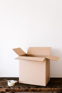 photo of a moving box with tape and scissors
